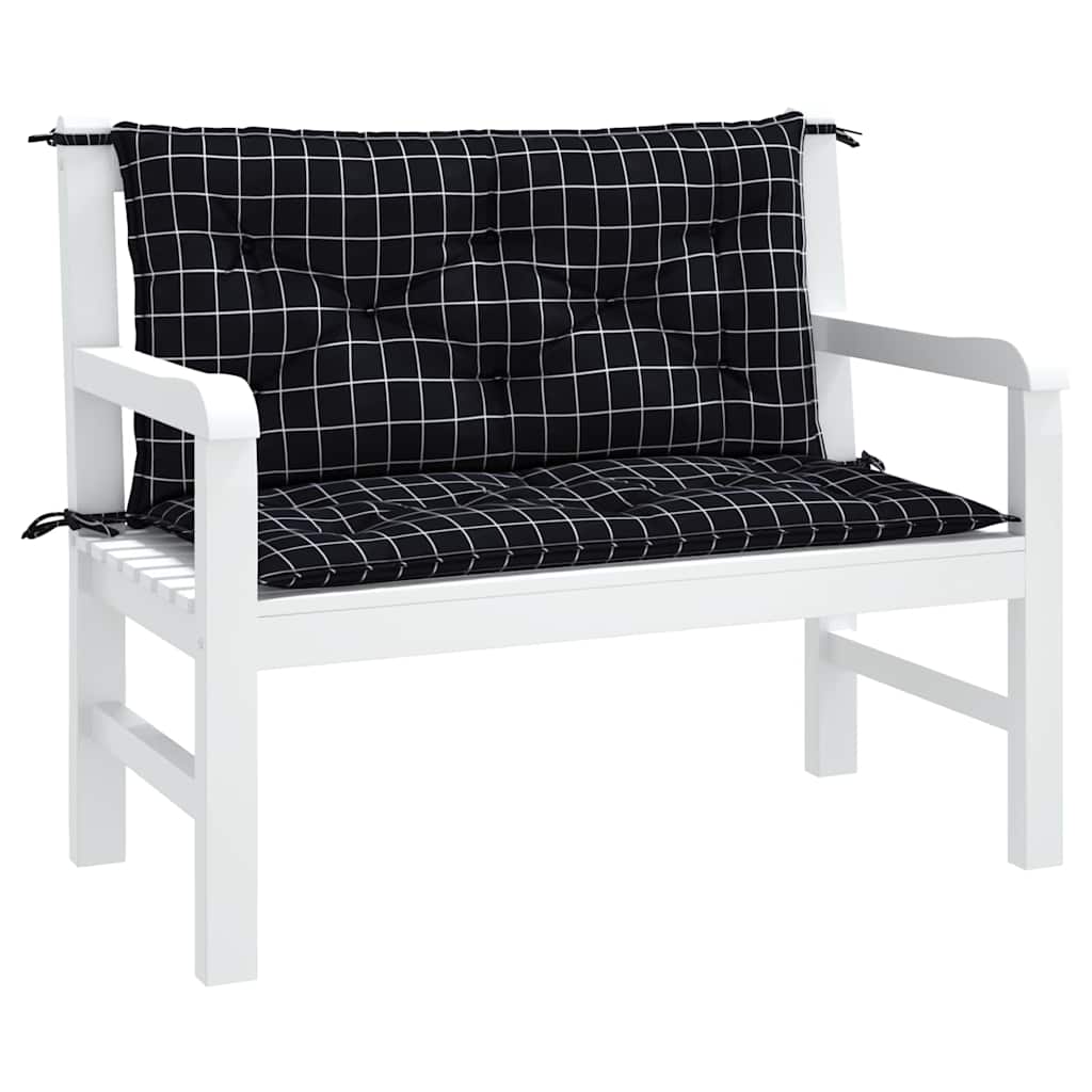 White wooden garden bench with black checkered seat and back cushions secured by ties.