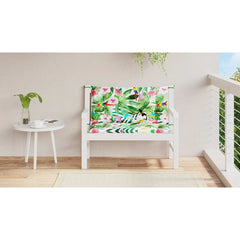 Two multicolor garden bench cushions with birds, leaves, and flowers on a white wooden bench.