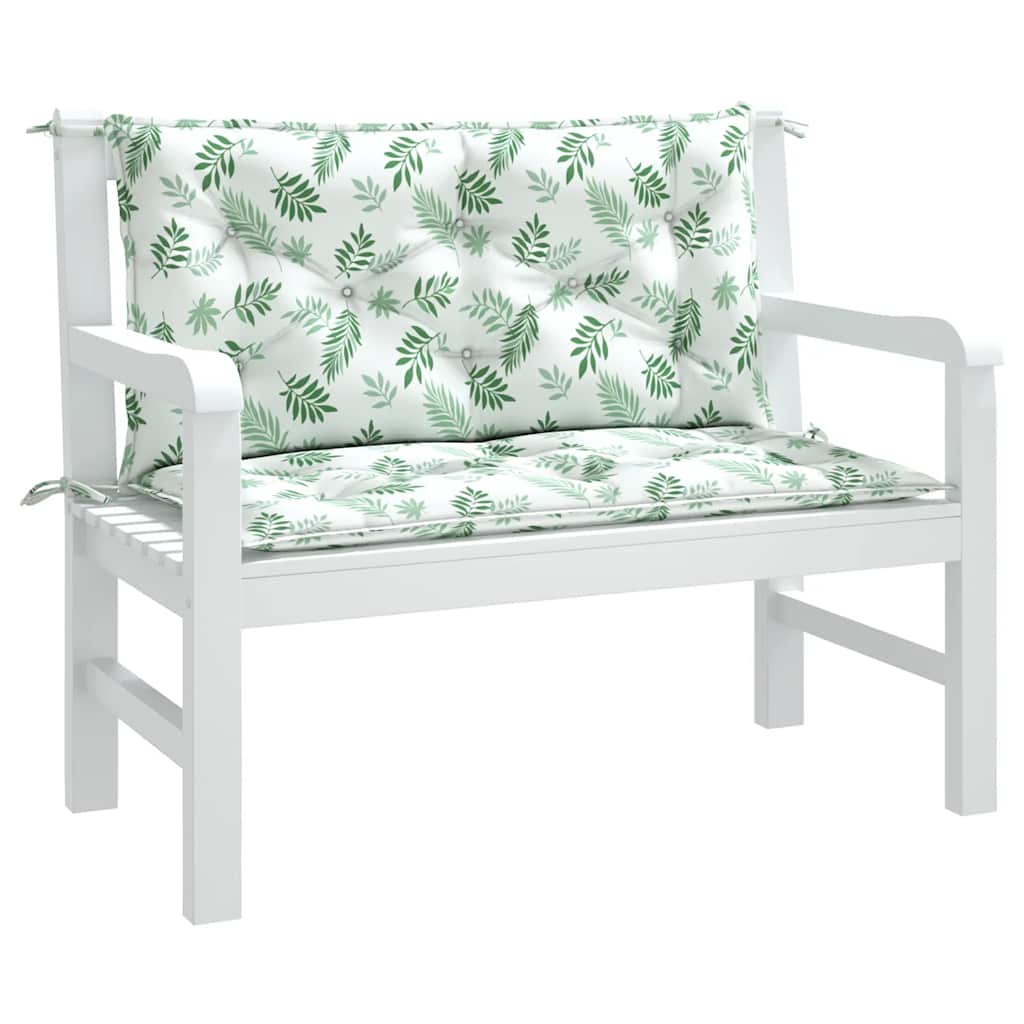 Two-piece leaf-pattern Oxford fabric cushions for a white garden bench, with seat and back pillows tied in place.