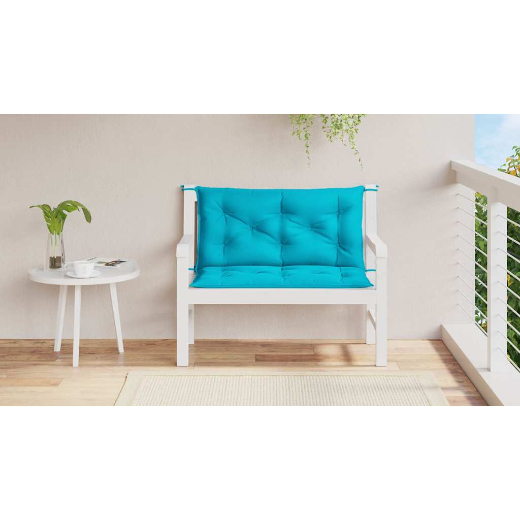 Two turquoise garden bench cushions with tufted design and ties, sized 39.4x19.7x2.8 inches.