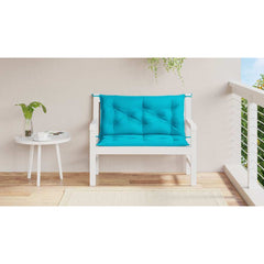 Two turquoise garden bench cushions with tufted design and ties, sized 39.4x19.7x2.8 inches.