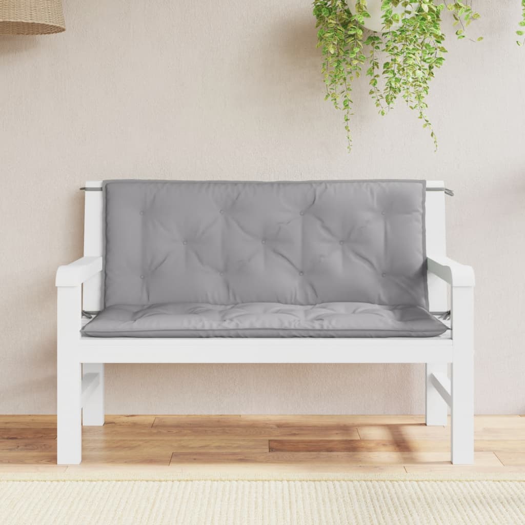 Two gray Oxford fabric bench cushions with tufted design, sized 47x20 inches, for garden use.