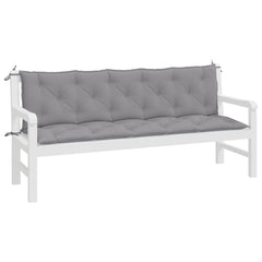 Two-piece gray Oxford fabric garden bench cushions with tufted design and ties.