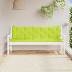 A white wooden bench on a balcony with bright green tufted cushions, hanging plant, and rattan lamp.