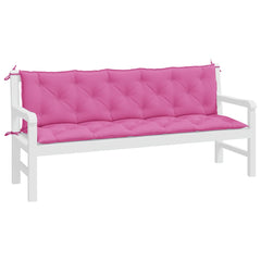 Two pink Oxford fabric cushions with tufted design and ties for a garden bench.