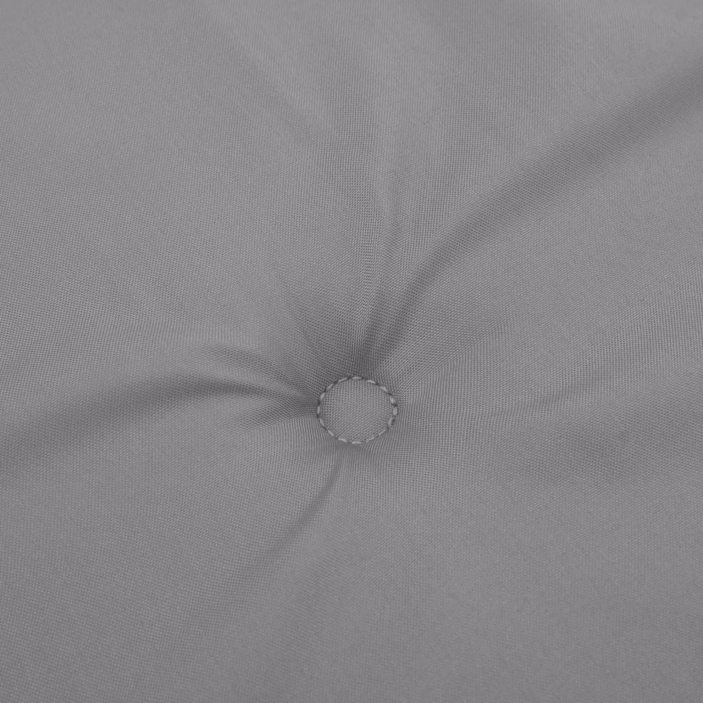 A close-up of a gray tufted cushion made of Oxford fabric.