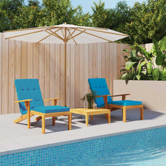 Two light blue Oxford fabric cushions on wooden deck chairs with a small table by the pool.