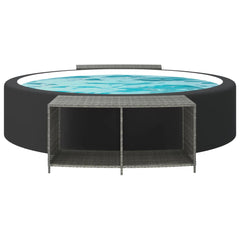 A gray poly rattan storage shelf unit is positioned next to a round inflatable hot tub.