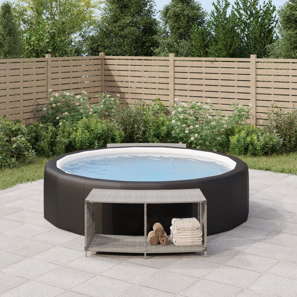 Two gray poly rattan storage shelves with shelves and towel, placed beside an inflatable hot tub on a patio.