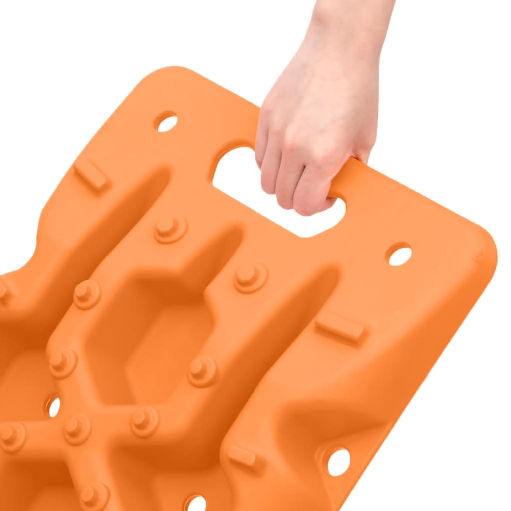 Orange reinforced nylon traction boards with handles, held by hand, 42.1x12.2x2.8in, 2-pack.