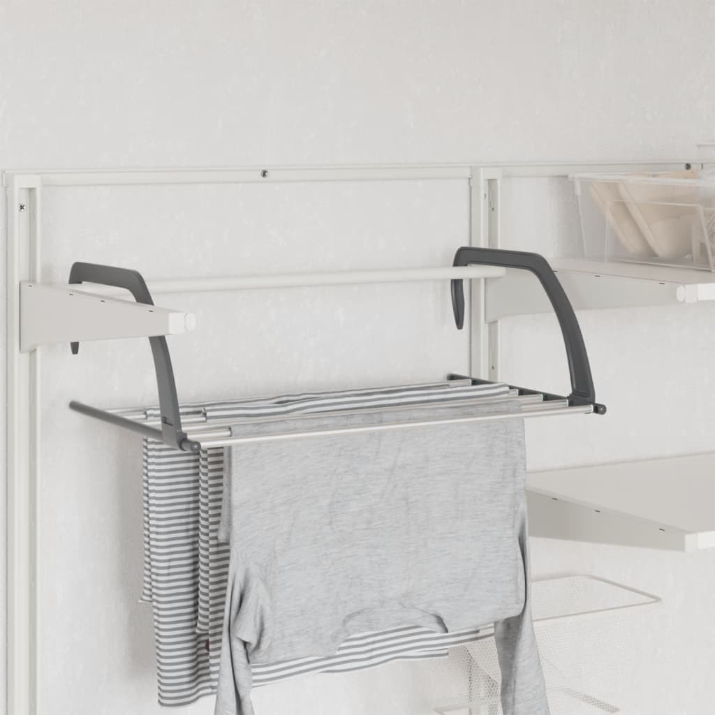 Two silver aluminum drying racks with foldable arms hanging on a wall rack.