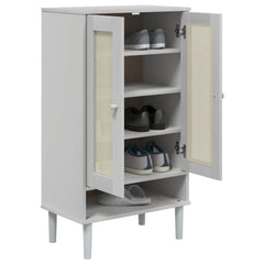 White solid pine wood shoe cabinet with rattan doors and five shelves containing shoes.