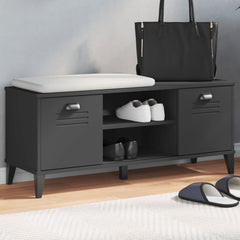 Black engineered wood shoe bench with cushioned seat, louvered doors, open cubbies, and stored shoes.
