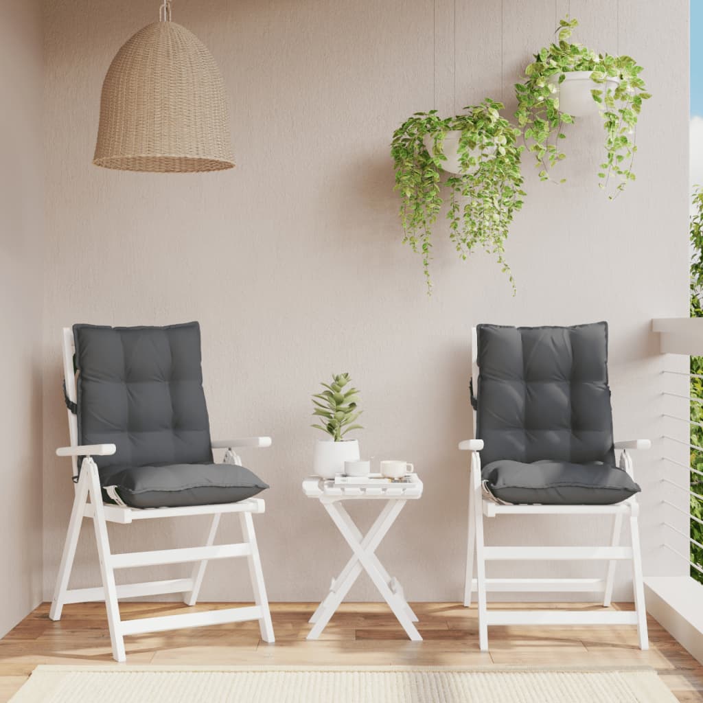 Two anthracite Oxford fabric lowback chair cushions with straps on white wooden chairs.