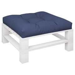 A navy blue tufted cushion rests on a white wooden pallet base.