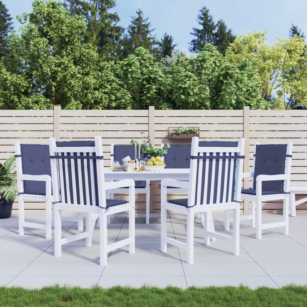 Six navy blue polyester cushions on white lowback chairs around an outdoor table.
