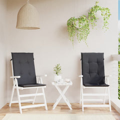 Two melange anthracite fabric highback chair cushions with straps on white wooden chairs