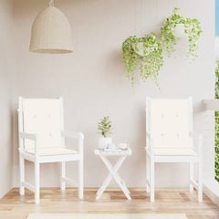 Two cream melange fabric lowback chair cushions on white patio chairs with a side table.