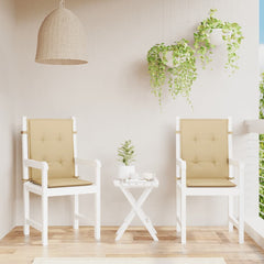 Two beige melange fabric lowback chair cushions on white chairs with a small table.