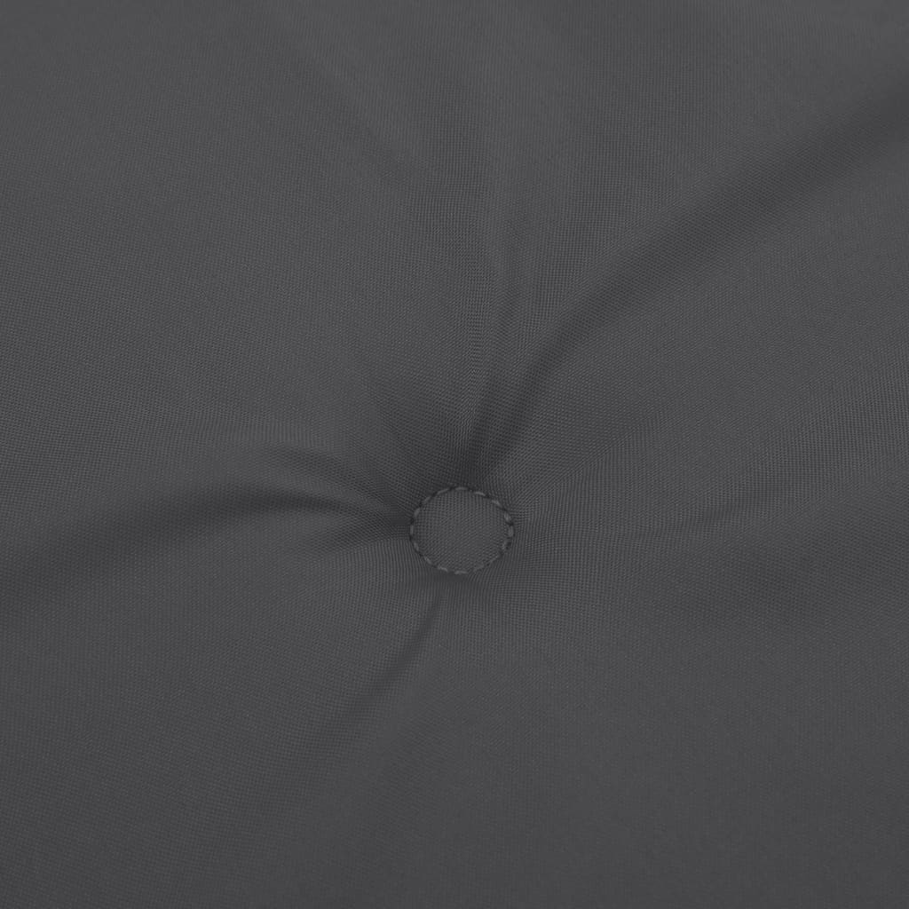Close-up of a dark gray tufted cushion with a subtle woven texture.