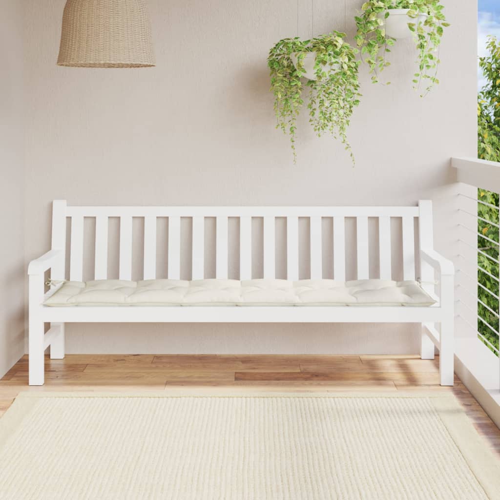 Cream garden bench cushion with beige seat pad on white outdoor bench.