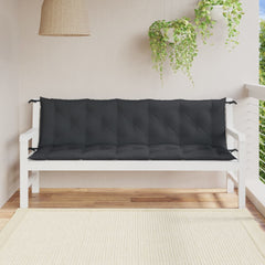 Two anthracite melange garden bench cushions on a white wooden bench on a sunny patio.