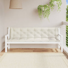 Two cream melange fabric bench cushions with tufted design on a white garden bench.