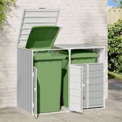 Gray steel wheelie bin storage unit with open doors revealing two green bins against a white brick wall.