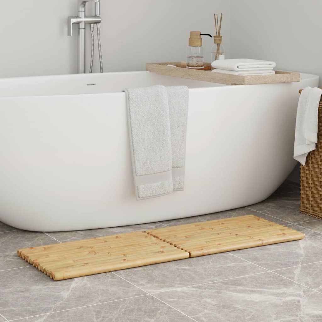 Two-piece set of bamboo bath mats, 19.7 by 13.8 inches, placed beside a white bathtub.