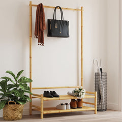 Bamboo clothes rack with two shelves, displaying scarf, handbag, shoes, and umbrella.