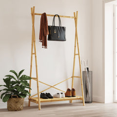 Bamboo clothes rack with hanging bar, shelf for shoes, and umbrella stand.