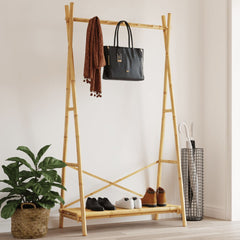Bamboo clothes rack with hanging rail, shelf for shoes, and natural wood finish.