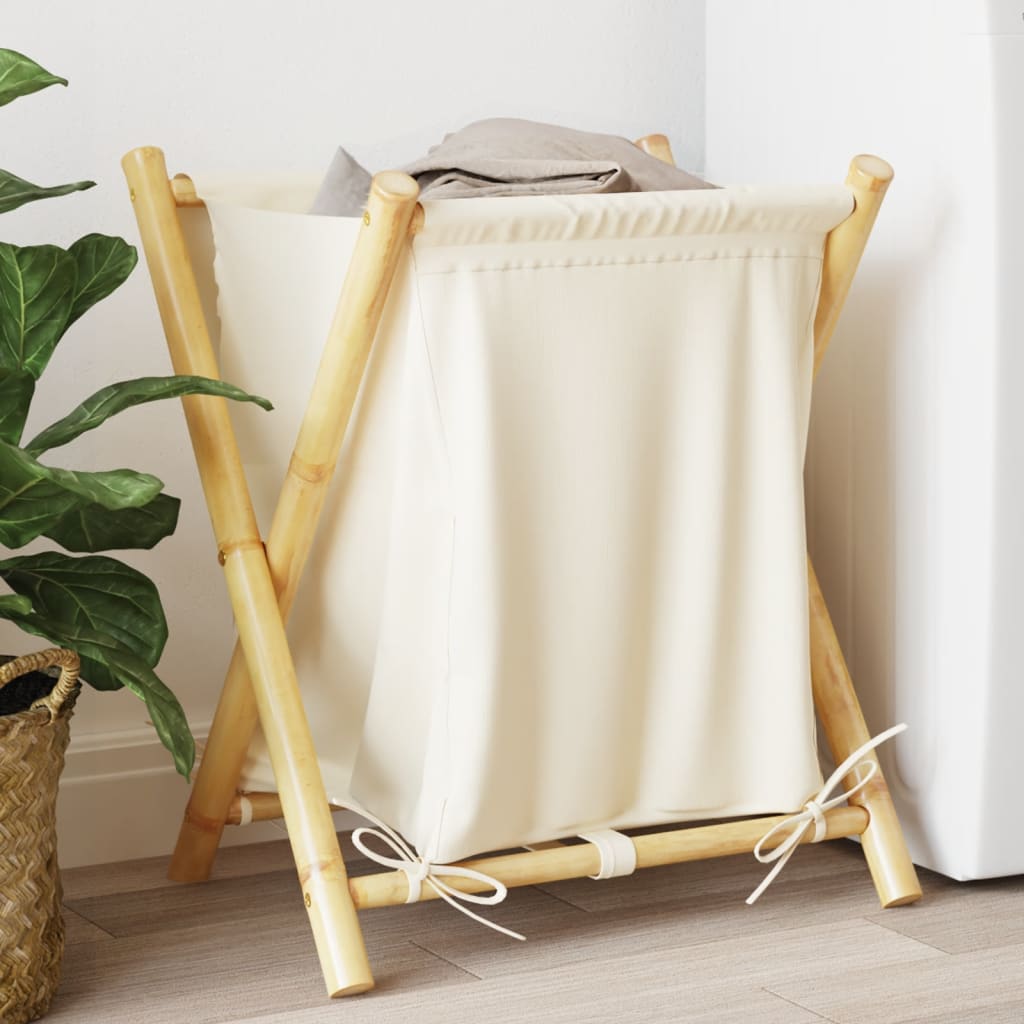 Cream white bamboo laundry basket with foldable frame and fabric liner, 17.7x21.7x25 inches.