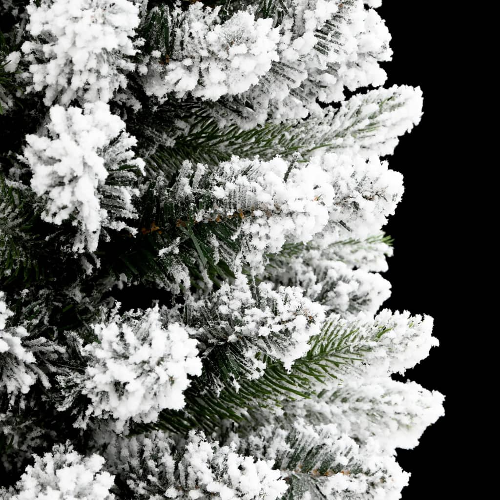 A 5ft slim artificial Christmas tree with flocked snow on green PVC and PE branches.