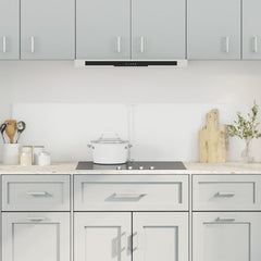 Two transparent tempered glass backsplash panels, 31.5x15.7 inches each, installed on a modern kitchen wall.
