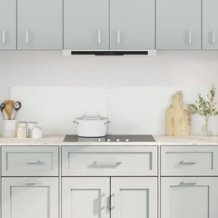 Two transparent tempered glass backsplash panels, 31.5x23.6 inches each, installed on a light gray kitchen wall behind a stove.