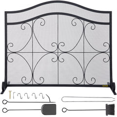 Black heavy-duty iron fireplace screen with double doors and decorative geometric patterns.