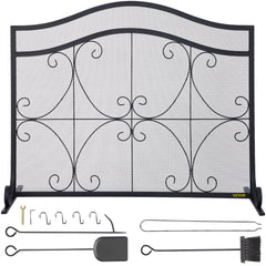 Black iron fireplace screen with a double-door design and geometric patterns for spark protection.