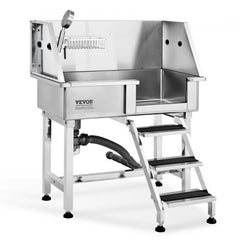 Stainless steel dog grooming tub with ramp, faucet, and anti-slip surfaces for safety.
