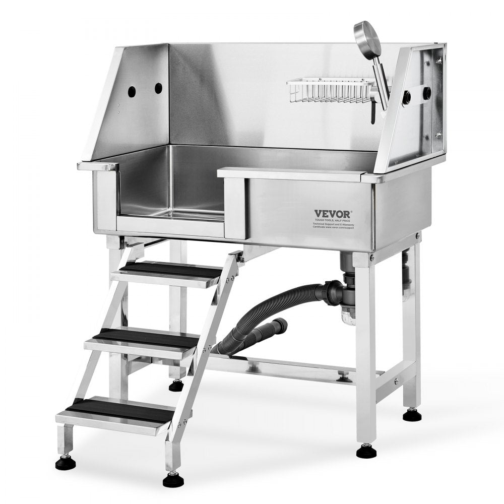Stainless steel dog grooming tub with ramp, faucet, and anti-slip surfaces for safety.