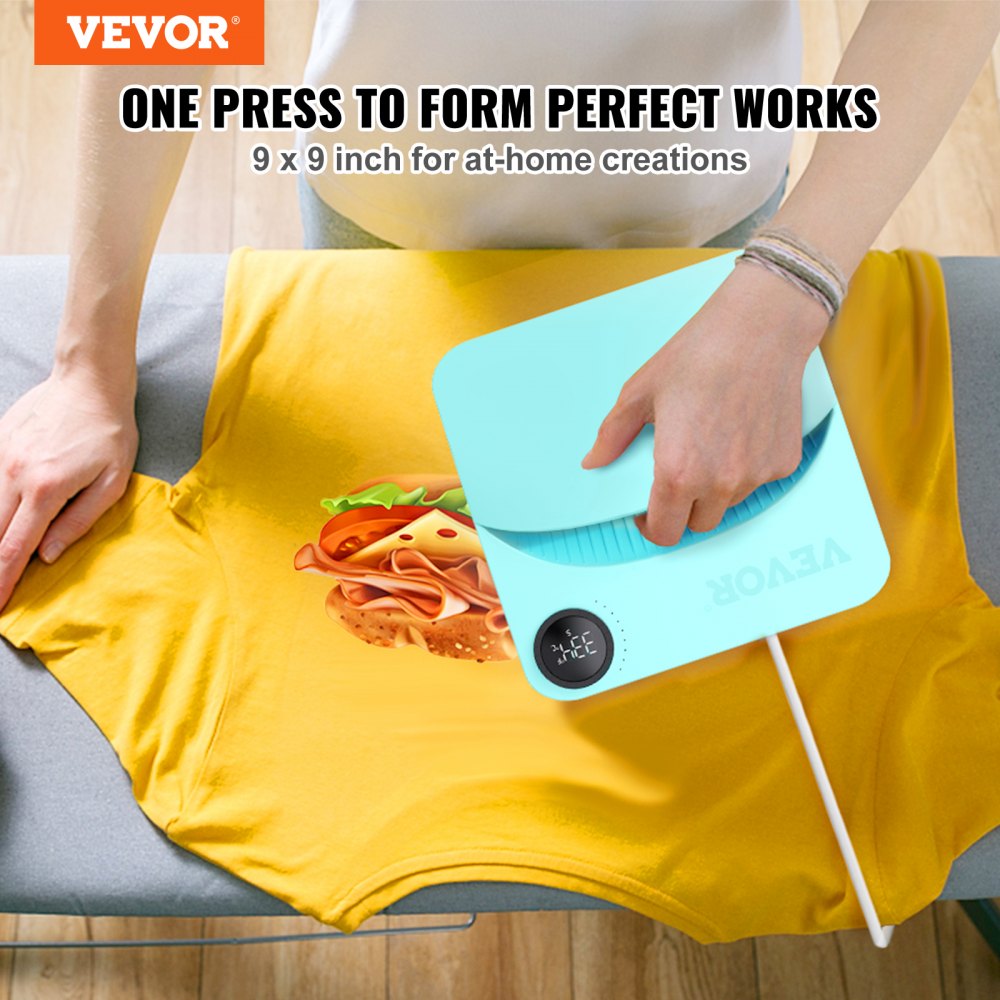 A hand pressing a teal 9x9 inch portable heat press machine onto a yellow t-shirt on an ironing board.