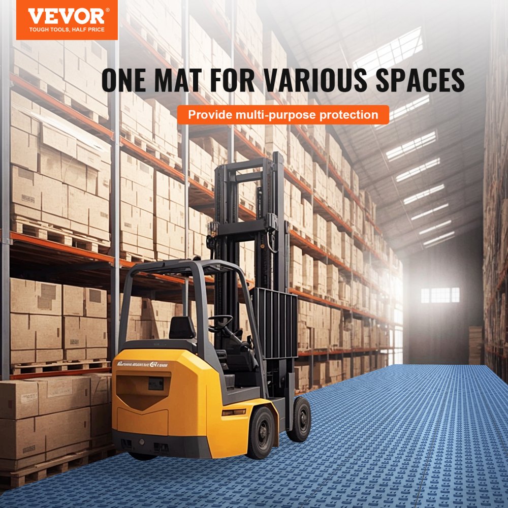 Blue interlocking garage floor tiles covering a warehouse floor with forklift and stacked boxes.