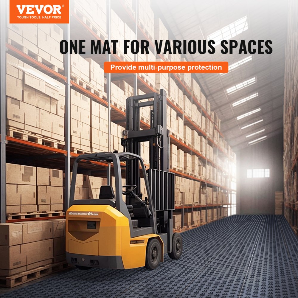 Graphite gray interlocking garage floor tiles with diamond texture, shown under a forklift in a warehouse.