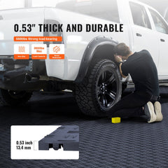 Graphite gray interlocking garage floor tiles, 0.53 inches thick, shown installed under a white truck wheel.
