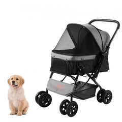 A black 4-wheel pet stroller with reversible handle and a small golden retriever puppy beside it.