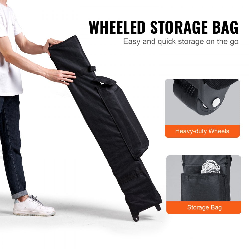 Man folding a dark gray 10x10 ft pop-up canopy tent into a wheeled storage bag.