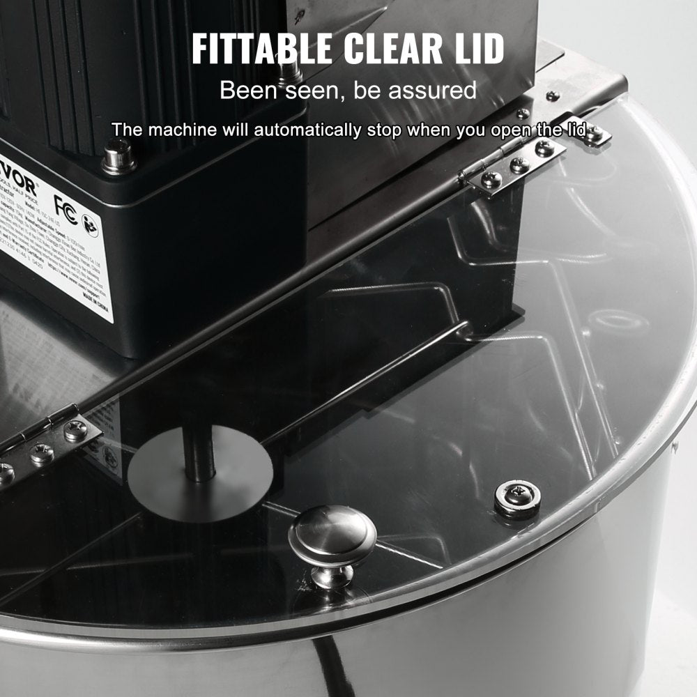 Stainless steel electric honey extractor with adjustable height and clear safety lid.