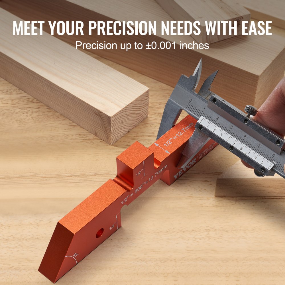 14-piece orange aluminum precision setup blocks with caliper on wood table.