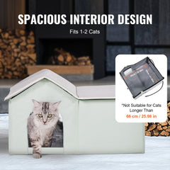 Green heated outdoor cat house with waterproof pad, dual exits, and insulated walls.