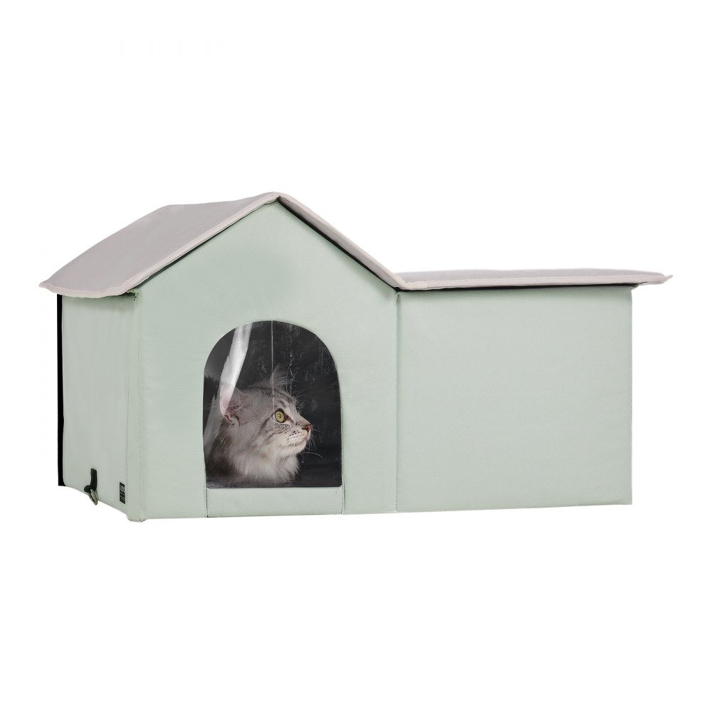 Green heated cat house with waterproof fabric, thermal insulation, and dual exits for easy access.